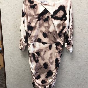 Jennifer Lopez beautiful dress. Multi colored blacks purples and cream colors